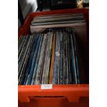 A selection of vinyl records and albums mostly 80's interest