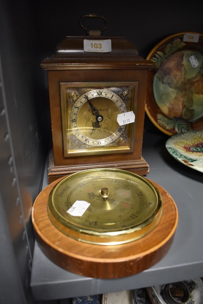 A small mantle or bracket clock by Elliott and a similar circular barrometer