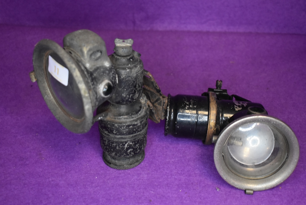 Two early 20th century bicycle or motor cycle carbide side lamps one marked Lucas and one marked