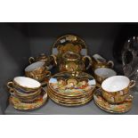 A Japanese part tea set having extensive decoration of samurai