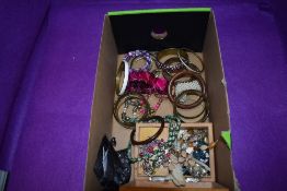 A selection of costume jewellery bangles, bracelets and necklaces and a treen musical jewellery
