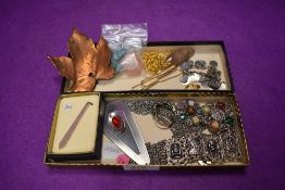 A small selection of costume jewellery including Celtic and stainless steel pendants, polished stone