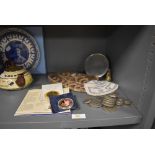 A selection of collectable coins and currency a portable mirror and two beaded sequin purses