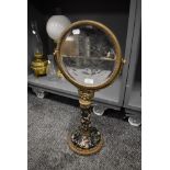 A Victorian style dressing table or shaving mirror having ormolu decoration with hand decorated