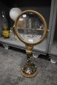 A Victorian style dressing table or shaving mirror having ormolu decoration with hand decorated