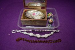 A small HM silver backed clothes brush, Ceramic brooches and two costume necklaces