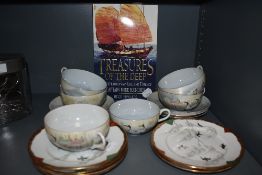 A selection of tea cups and saucers in an egg shell China having crane and bird decoration