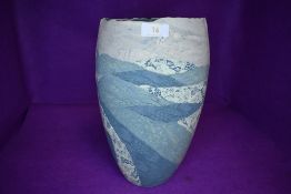 A studio pottery vase having green glaze decoration by Syl Macro ceramics Alston