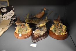 Four figure studies of birds including Border Fine Arts pheasant figure