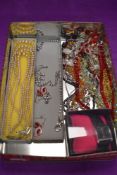 A small selection of costume jewellery including strings of beads, diamante wrist watch etc