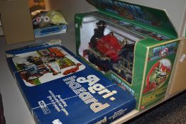A vintage Agri hazard board game and A boxed steam engine toy.