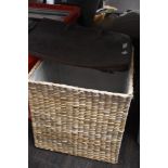 A wicker woven storage box