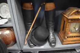 A pair of antique riding boots with accompanying boot trees , and a Christies of London bowler hat