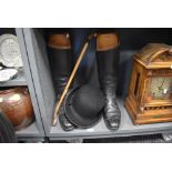 A pair of antique riding boots with accompanying boot trees , and a Christies of London bowler hat