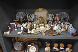 A selection of various trinkets and figures including farrings and a fimille rouge Chinese vase