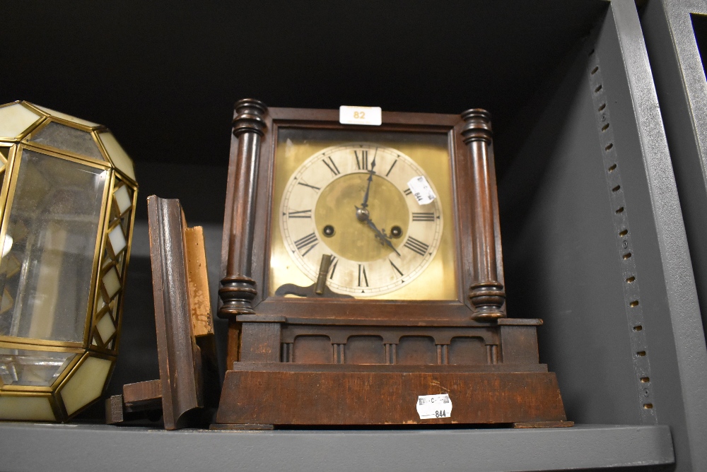 A late Victorian bracket clock having brass face dial and stained case as found