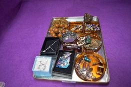 A mixed lot of jewellery and similar including beads, badges, bracelet and brooche