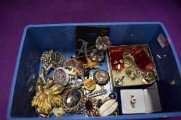 A selection of costume jewellery including brooches, rings, earrings etc