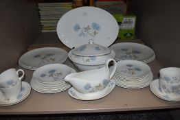 A Wedgwood 'Ice rose' partial dinner service, plates, tureen,cups and saucers,gravy boat and more