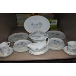 A Wedgwood 'Ice rose' partial dinner service, plates, tureen,cups and saucers,gravy boat and more