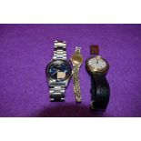 Two gents wrist watches, a ladies wrist watch and a royal souvenir charm