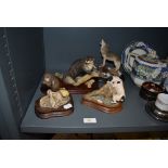 Four figure studies of animals including Border Fine Arts otter figure