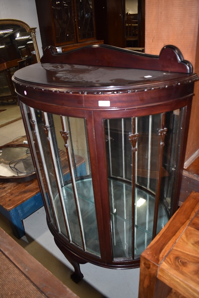 An early 20th Century mahogany bow fronted display cabinet