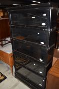 A late 19th or early 20th Century stacking bookcase, labelled Globe Wernicke comprising of five dark