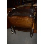 An early 20th Century oak and ply tea trolley and a similar bed tray (no legs)