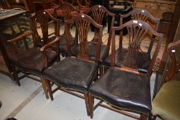 A set of six (five plus one) slat back dining chairs having studded leather seats (in need of