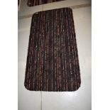 A carpet remnant rug, having rounded edges, approx. 130 x 68cm