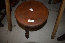 A traditional milking type stool having triple turned legs