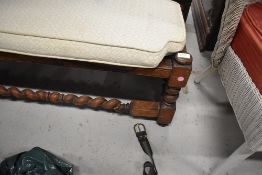 A vintage mahogany foot rest or stool having barley twist legs and stretcher rails