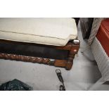 A vintage mahogany foot rest or stool having barley twist legs and stretcher rails