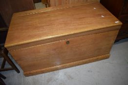 A large stripped vintage bedding box or chest having handles to sides.