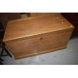 A large stripped vintage bedding box or chest having handles to sides.