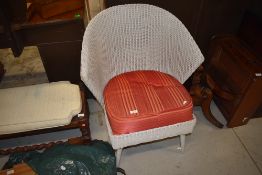 A vintage wicker Lloyd Loom style chair having fan shaped back.