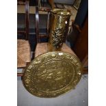 A brass stick stand and circular tray