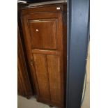 An early 20th Century oak hall robe having panel doors