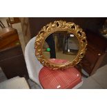 A reproduction gilt effect framed mirror