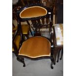 A dark stained continental style carver chair