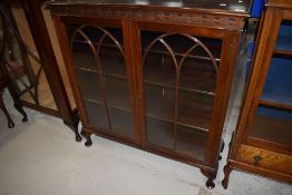 An early 20th Century mahogany glazed bookcase or display cabinet, width approx. 107cm