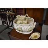 A reproduction footbath, wash jug and soap dish