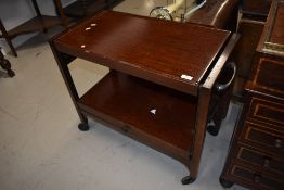 A traditional stained frame tea trolley