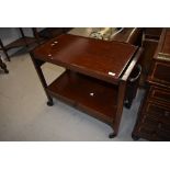 A traditional stained frame tea trolley