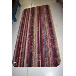 A carpet remnant rug, having rounded edges, approx. 190 x 92cm
