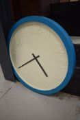 An oversized industrial style wall clock , teal blue frame, named for Karlsson, diameter approx.