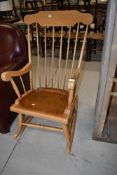 A traditional beech rocking chair