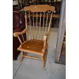 A traditional beech rocking chair