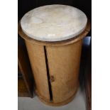 A Victorian pot cupboard of cylindrical form with marble top, very bleached